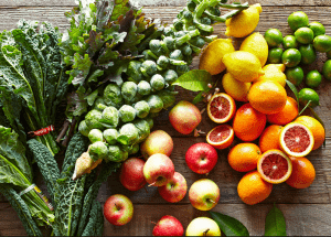 a group of fruits and vegetables on a wood surface Healthy Weight Loss Diets New Scarborough
